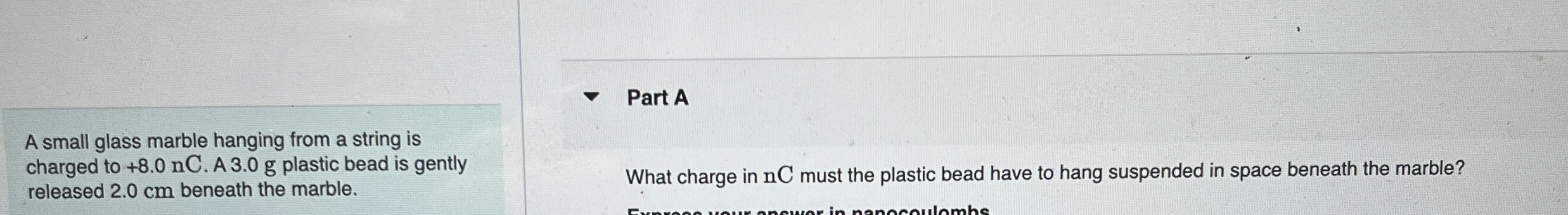 A small glass marble hanging from a string is