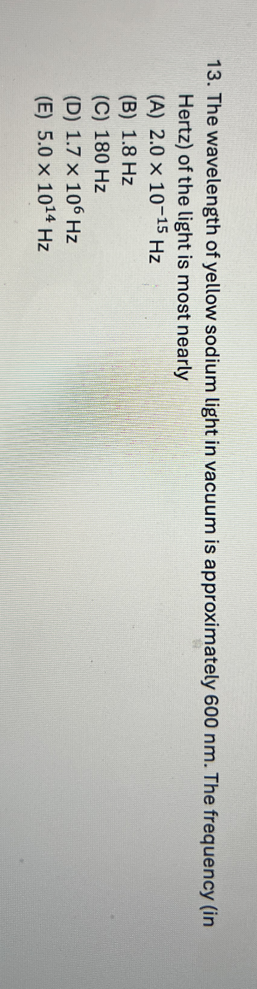 The wavelength of yellow sodium light in vacuum