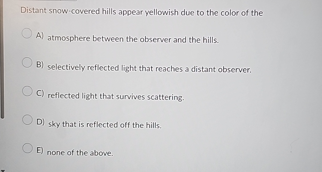 Distant snow - covered hills appear yellowish due