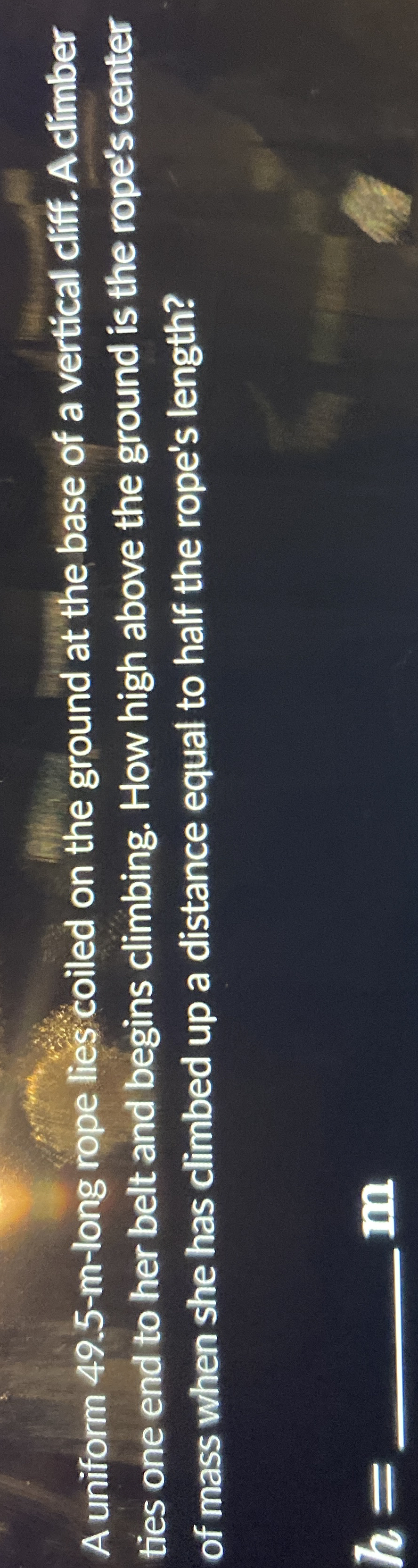 A uniform 4 9 . 5 - m - long rope lies coiled on