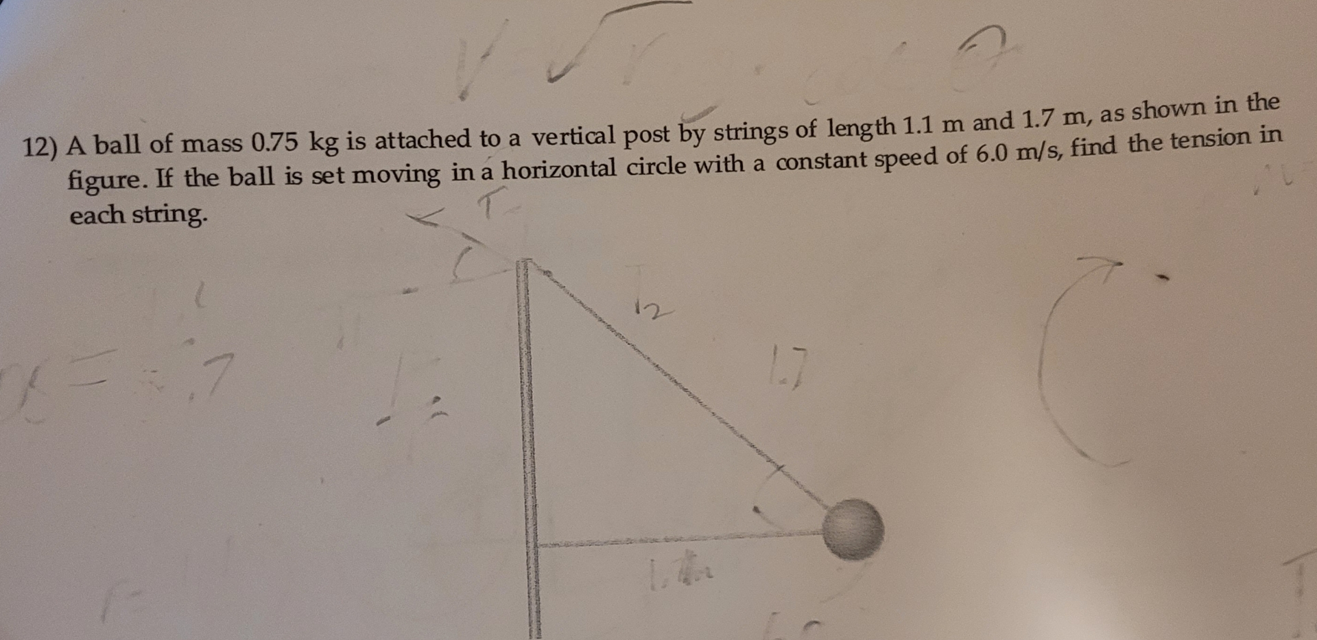 A ball of mass 0 . 7 5 kg is attached to a