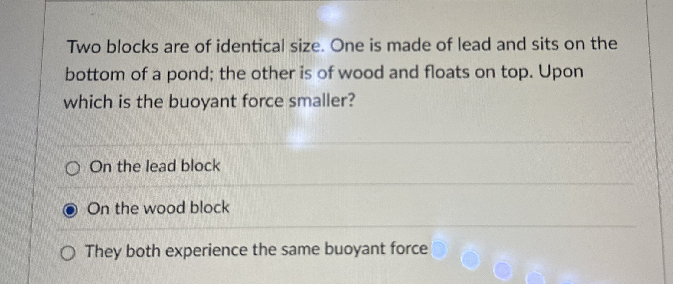 Two blocks are of identical size. One is made of