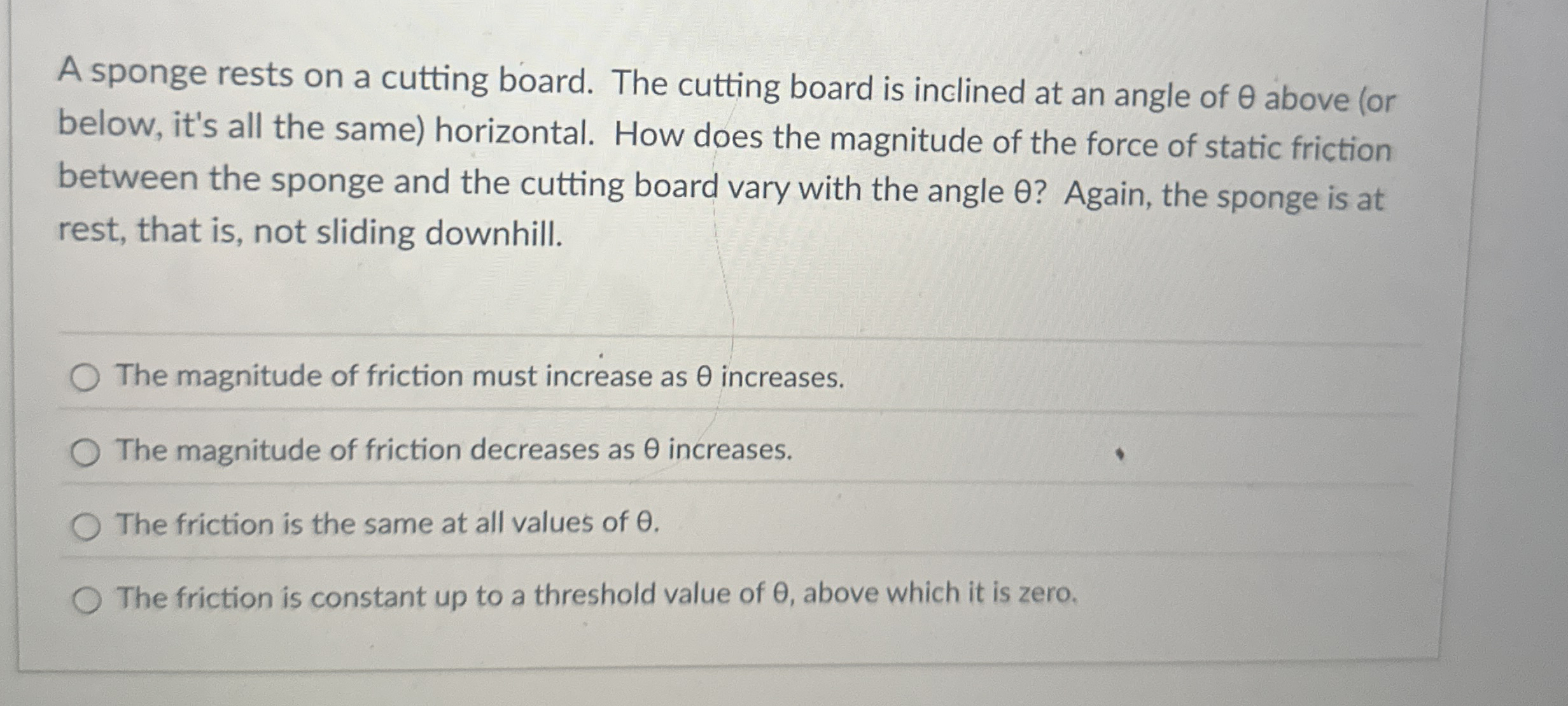 A sponge rests on a cutting board. The cutting