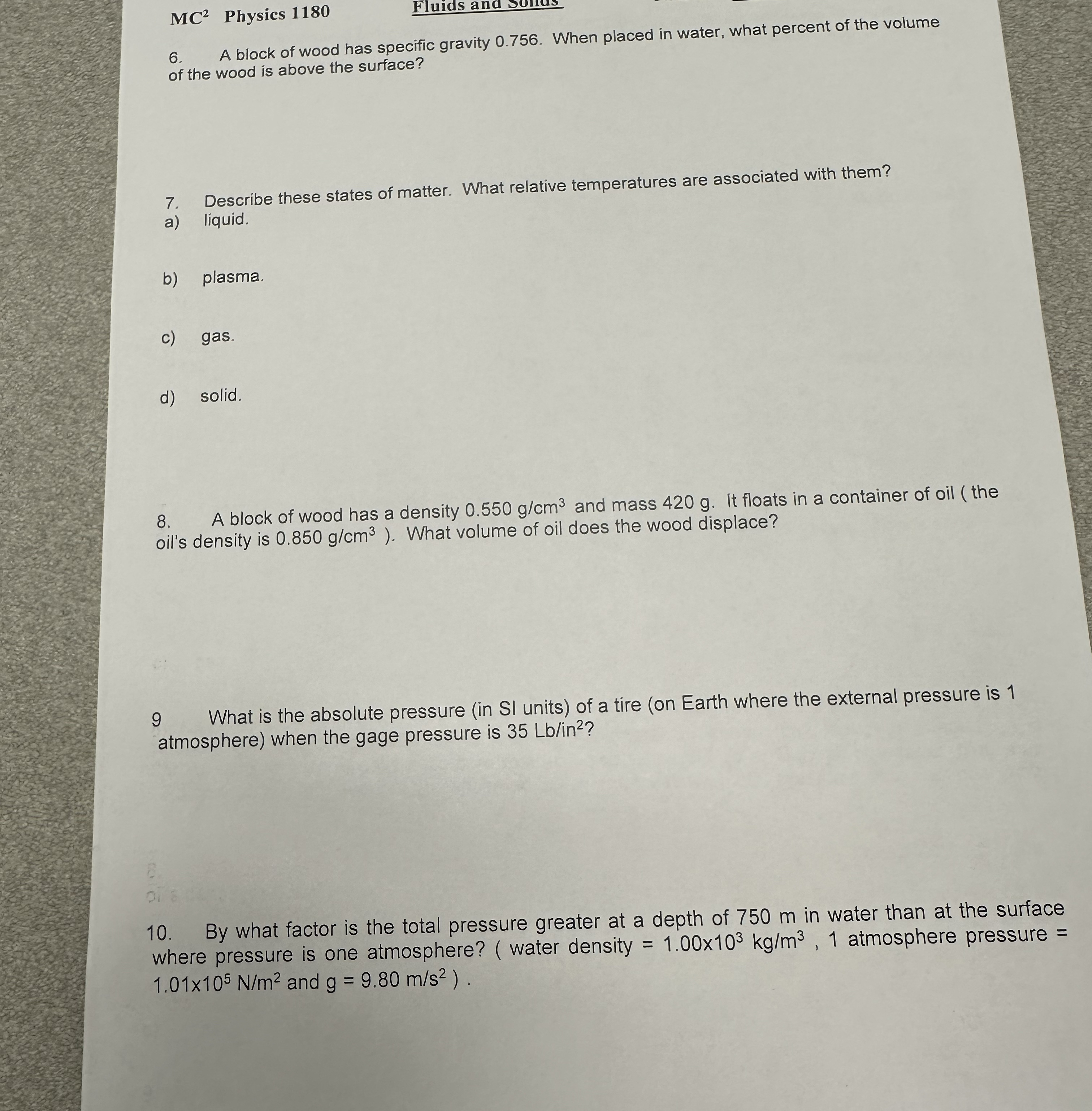 M C 2 Physics 1 1 8 0 6 . A block of wood has