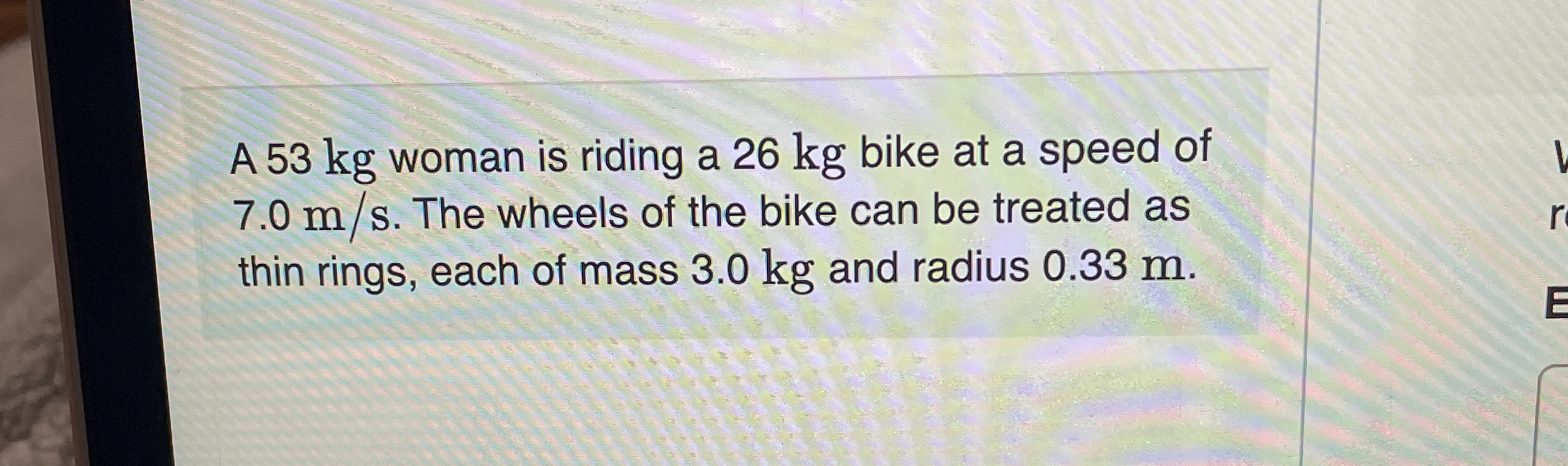 A 5 3 kg woman is riding a 2 6 kg bike at a speed