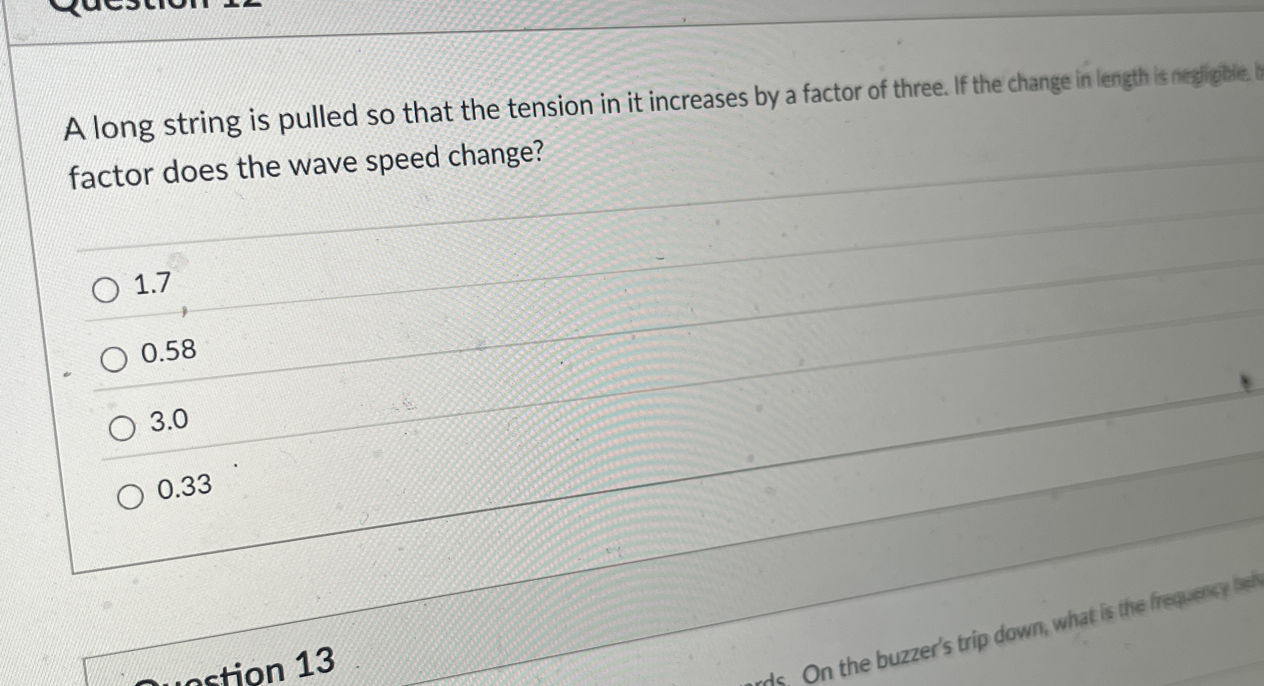 A long string is pulled so that the tension in it