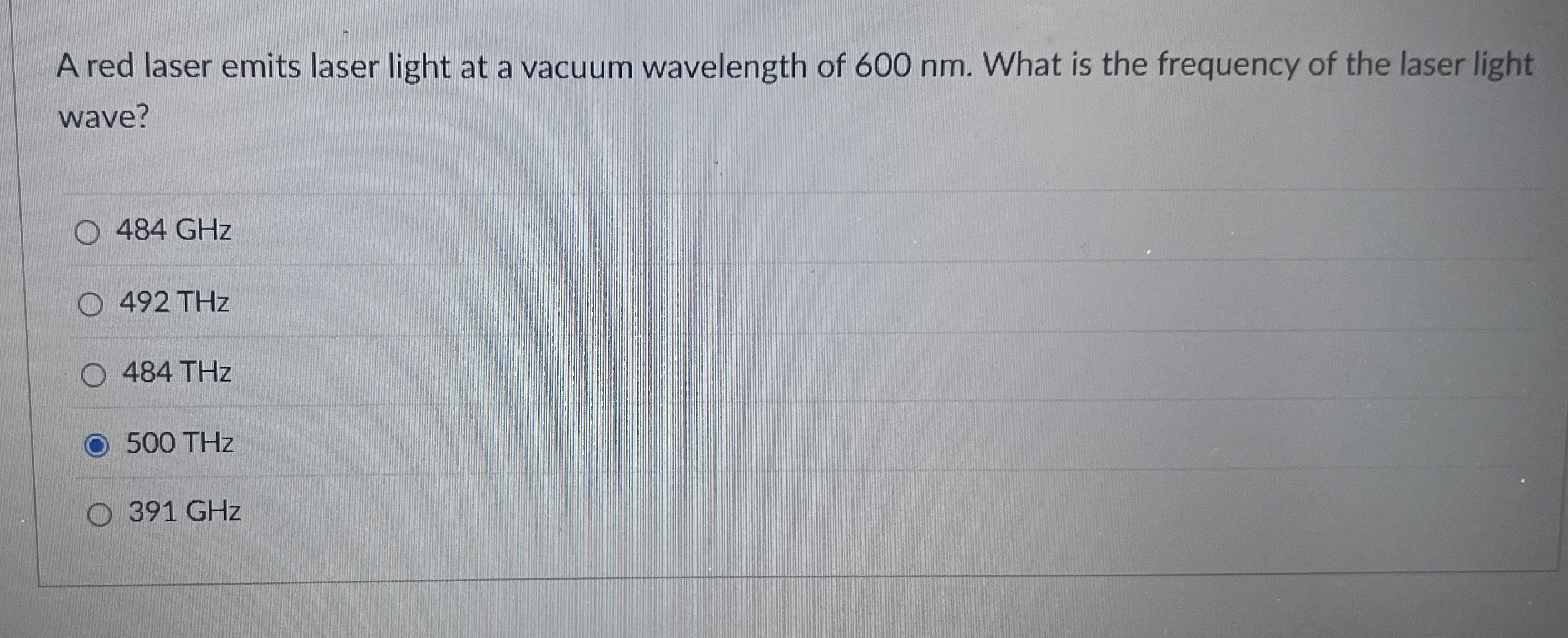 A red laser emits laser light at a vacuum