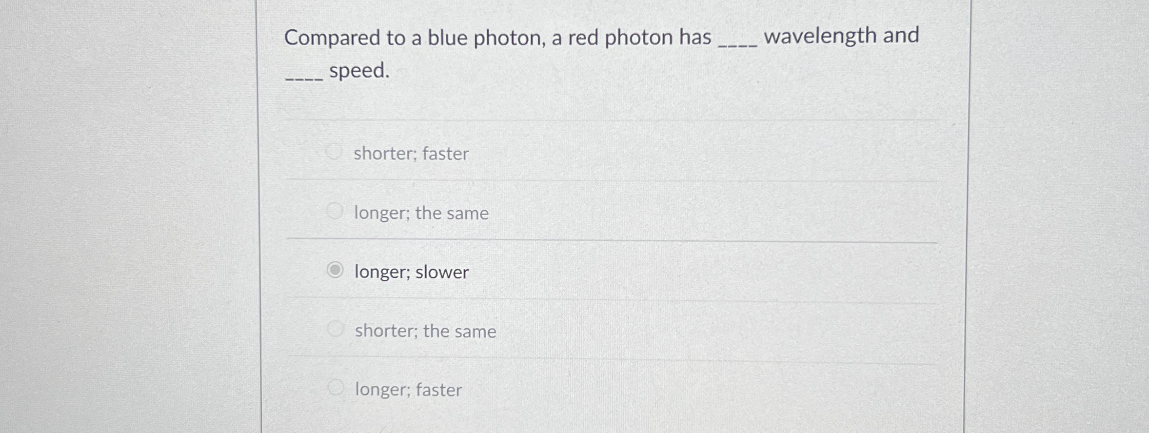 Compared to a blue photon, a red photon has q ,