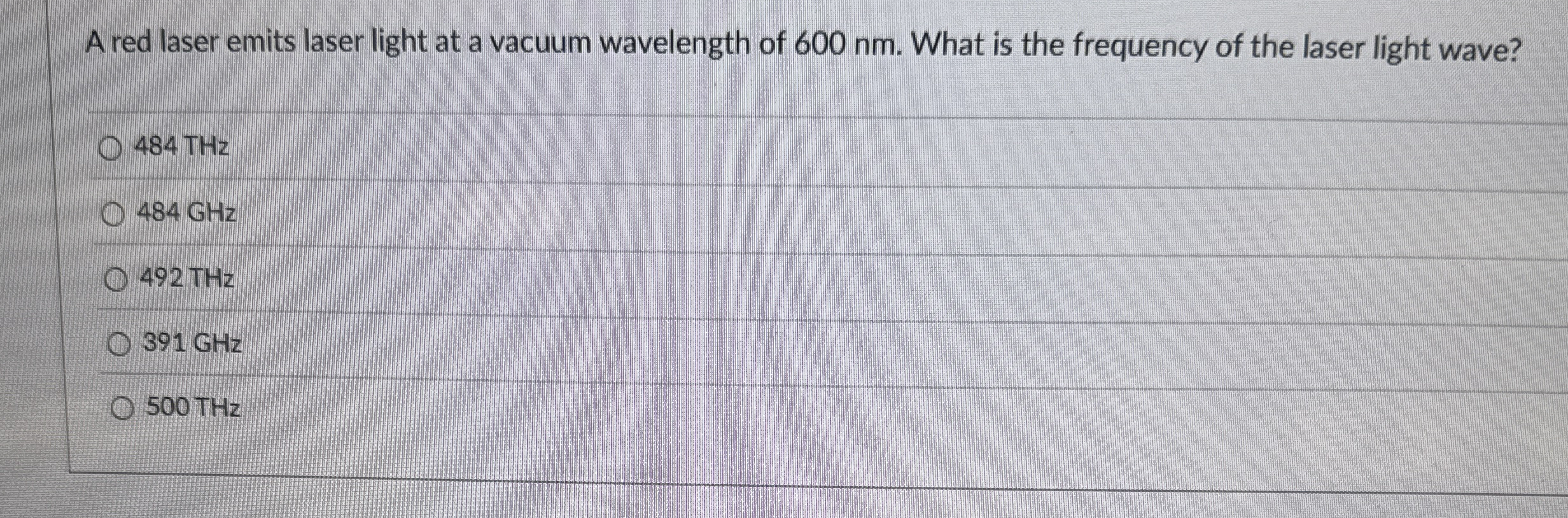 A red laser emits laser light at a vacuum