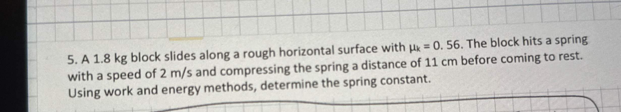 A 1 . 8 kg block slides along a rough horizontal