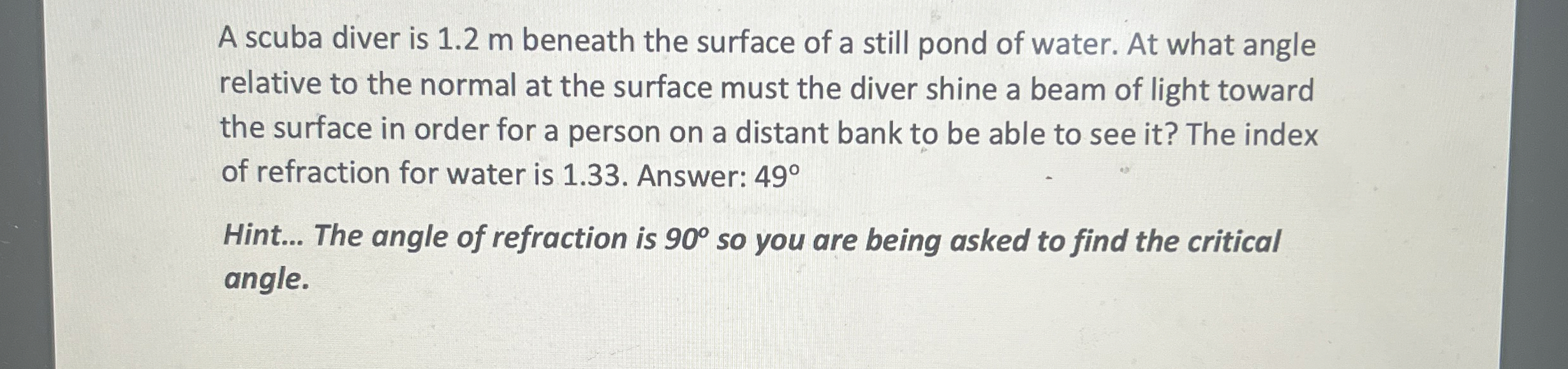 A scuba diver is 1 . 2 m beneath the surface of a
