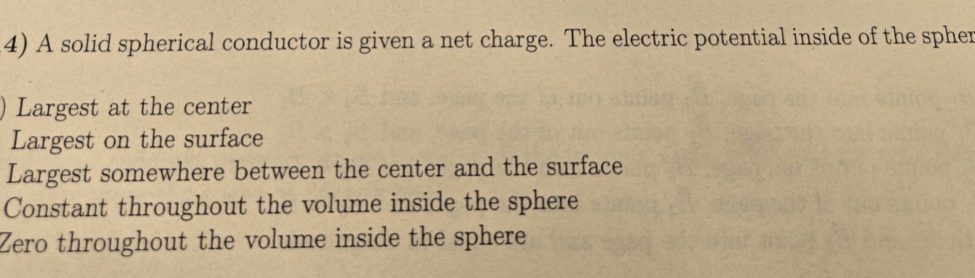 A solid spherical conductor is given a net