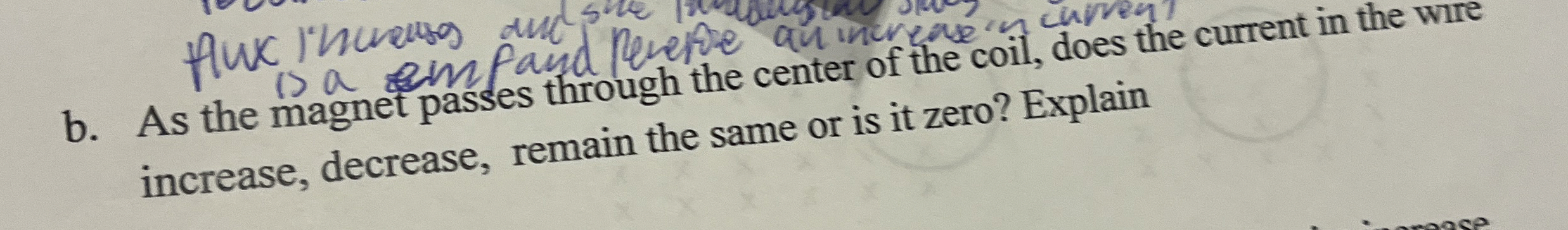 b . As the magnet passes through the center of
