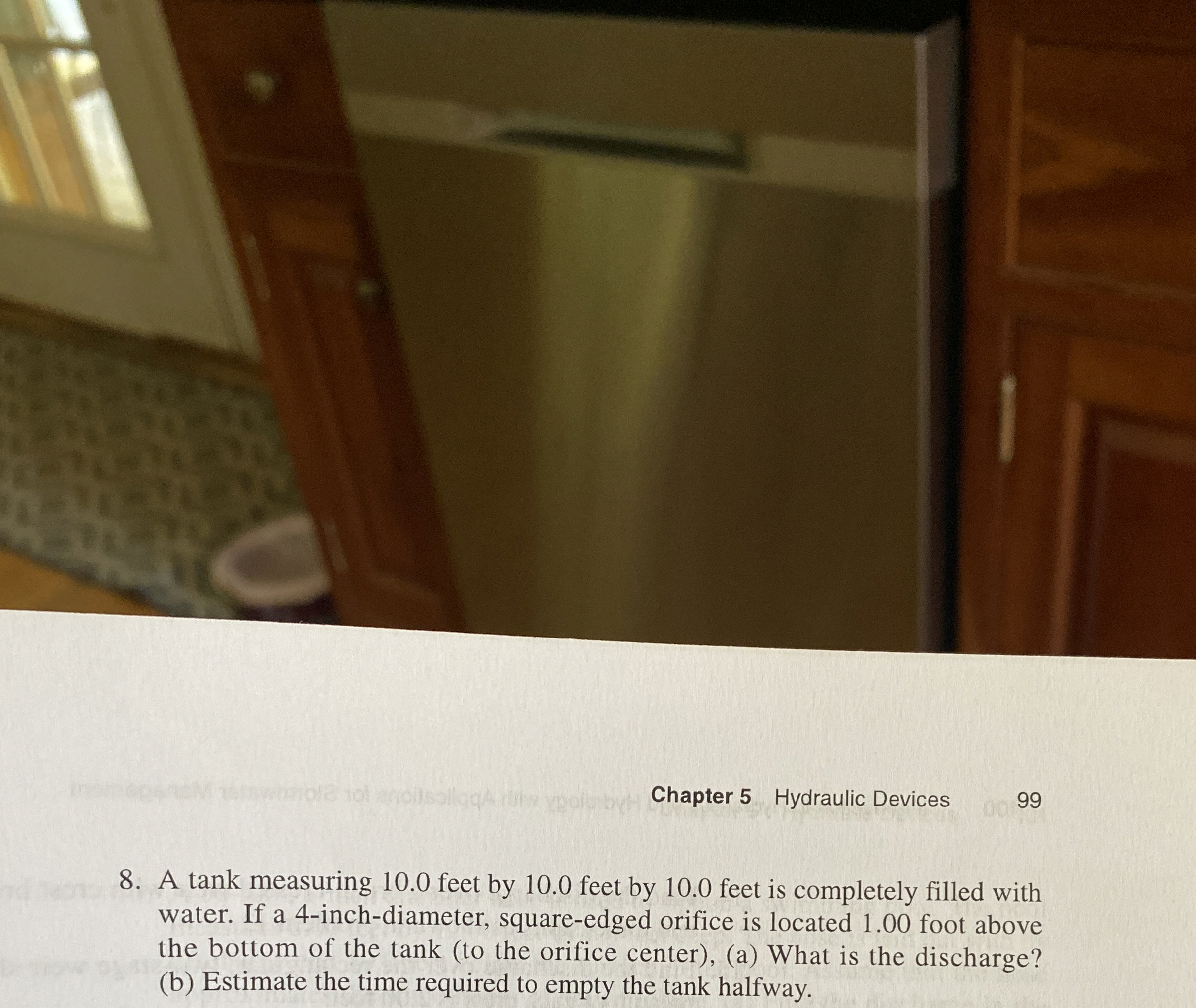 A tank measuring 1 0 . 0 feet by 1 0 . 0 feet by