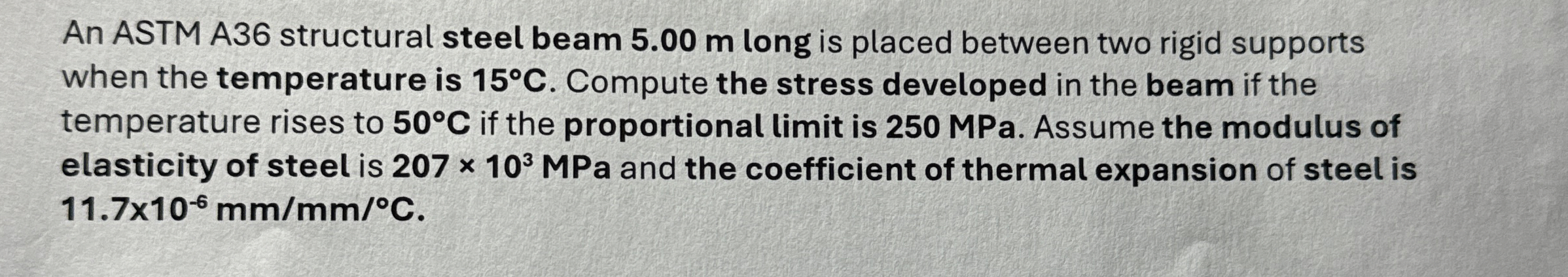 An ASTM A 3 6 structural steel beam 5 . 0 0 m