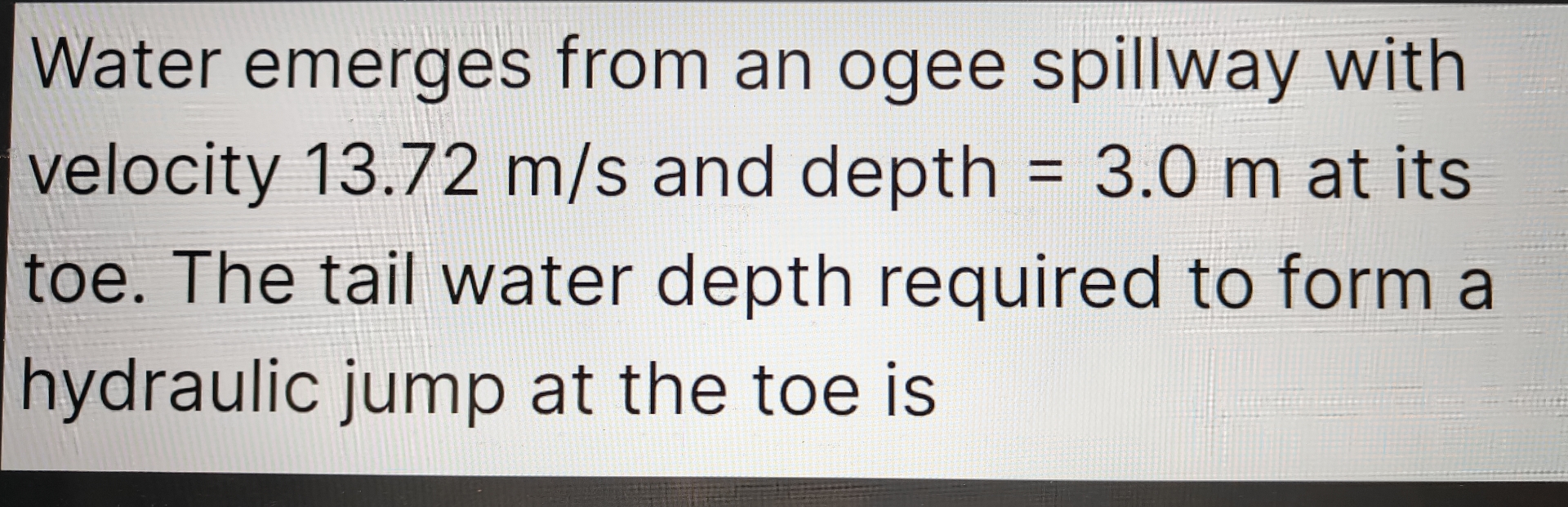 Water emerges from an ogee spillway with velocity