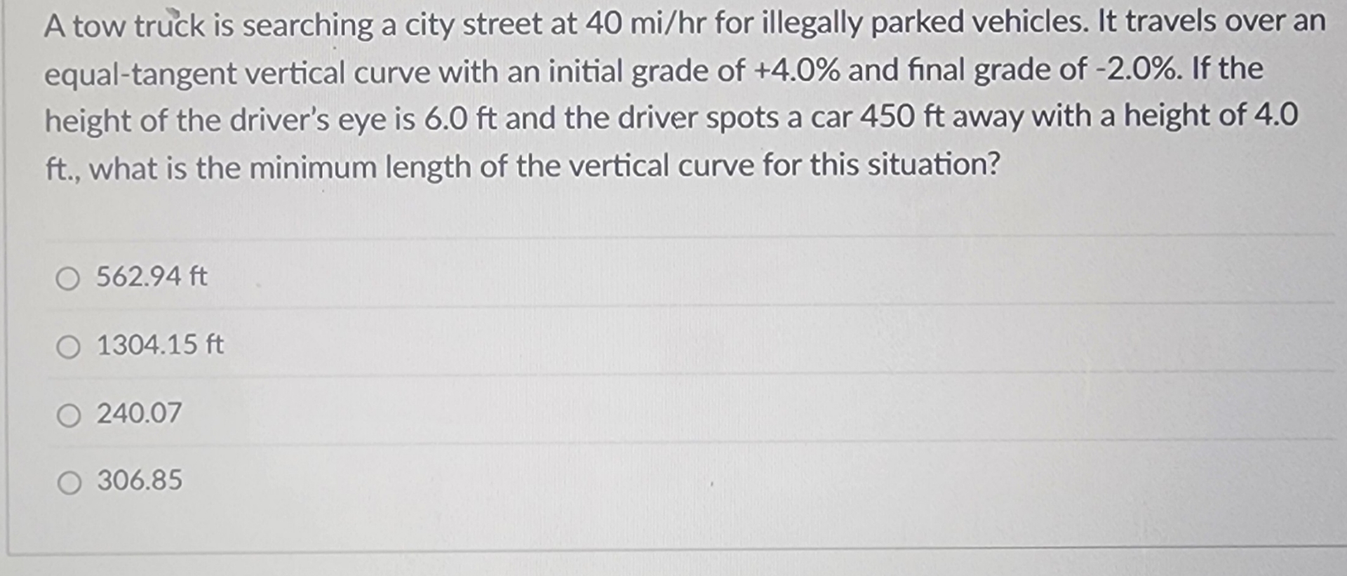 A tow truck is searching a city street at 4 0 m i