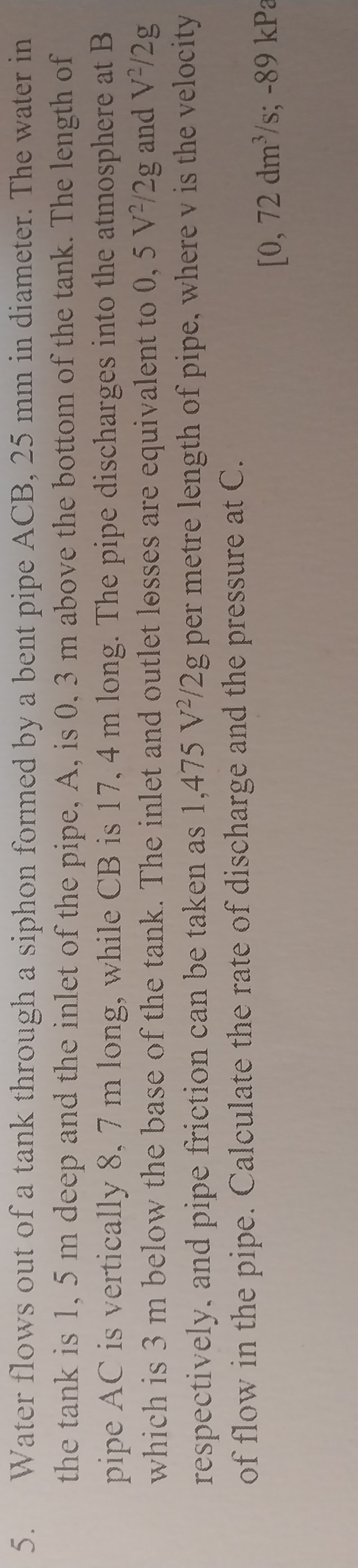 Water flows out of a tank through a siphon formed