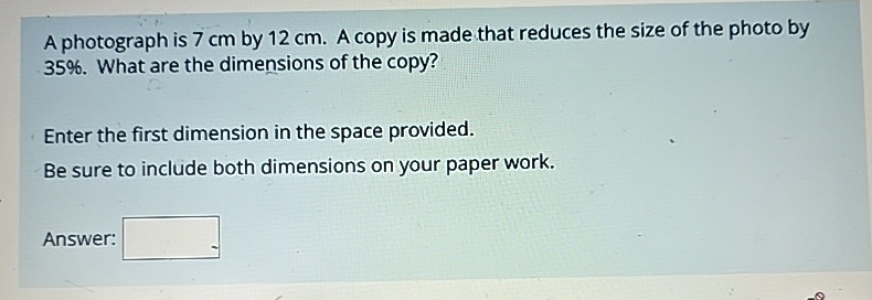 A photograph is 7 c m by 1 2 c m . A copy is made