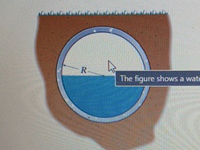 The sewer pipe, made of unfinished concrete, is