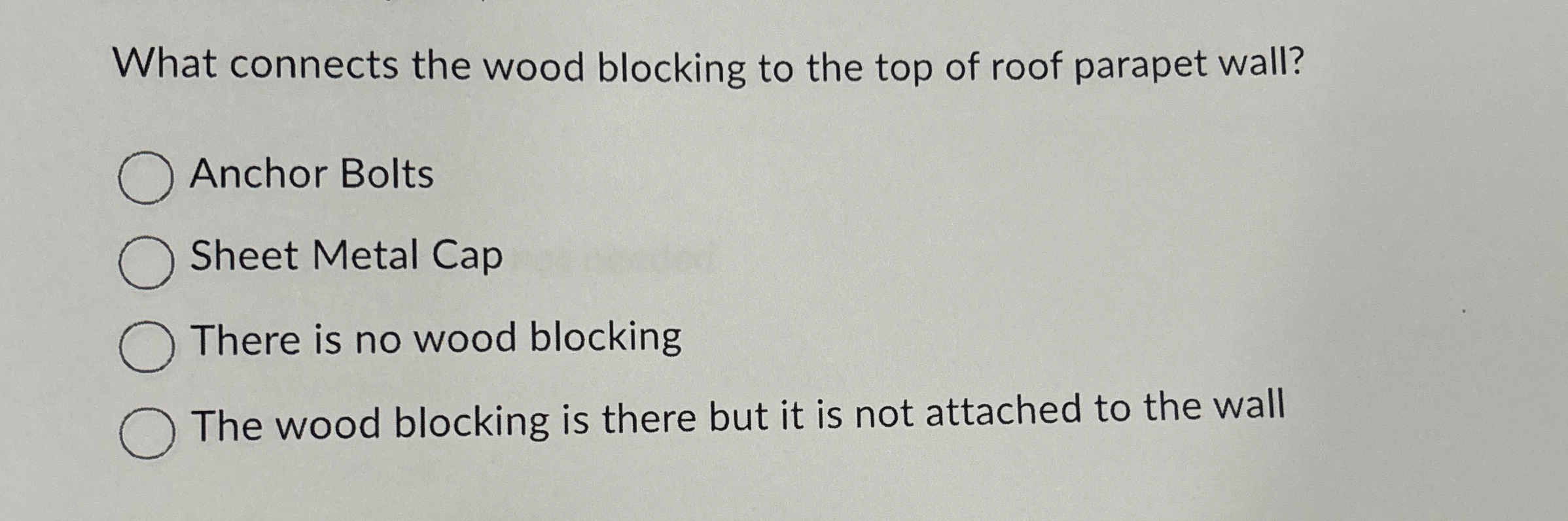 What connects the wood blocking to the top of