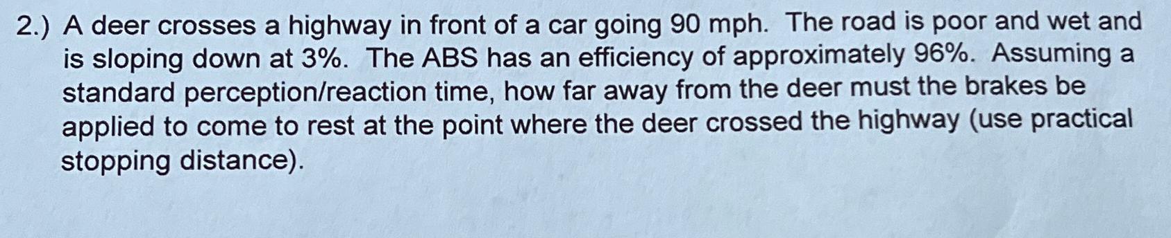 2 . ) A deer crosses a highway in front of a car