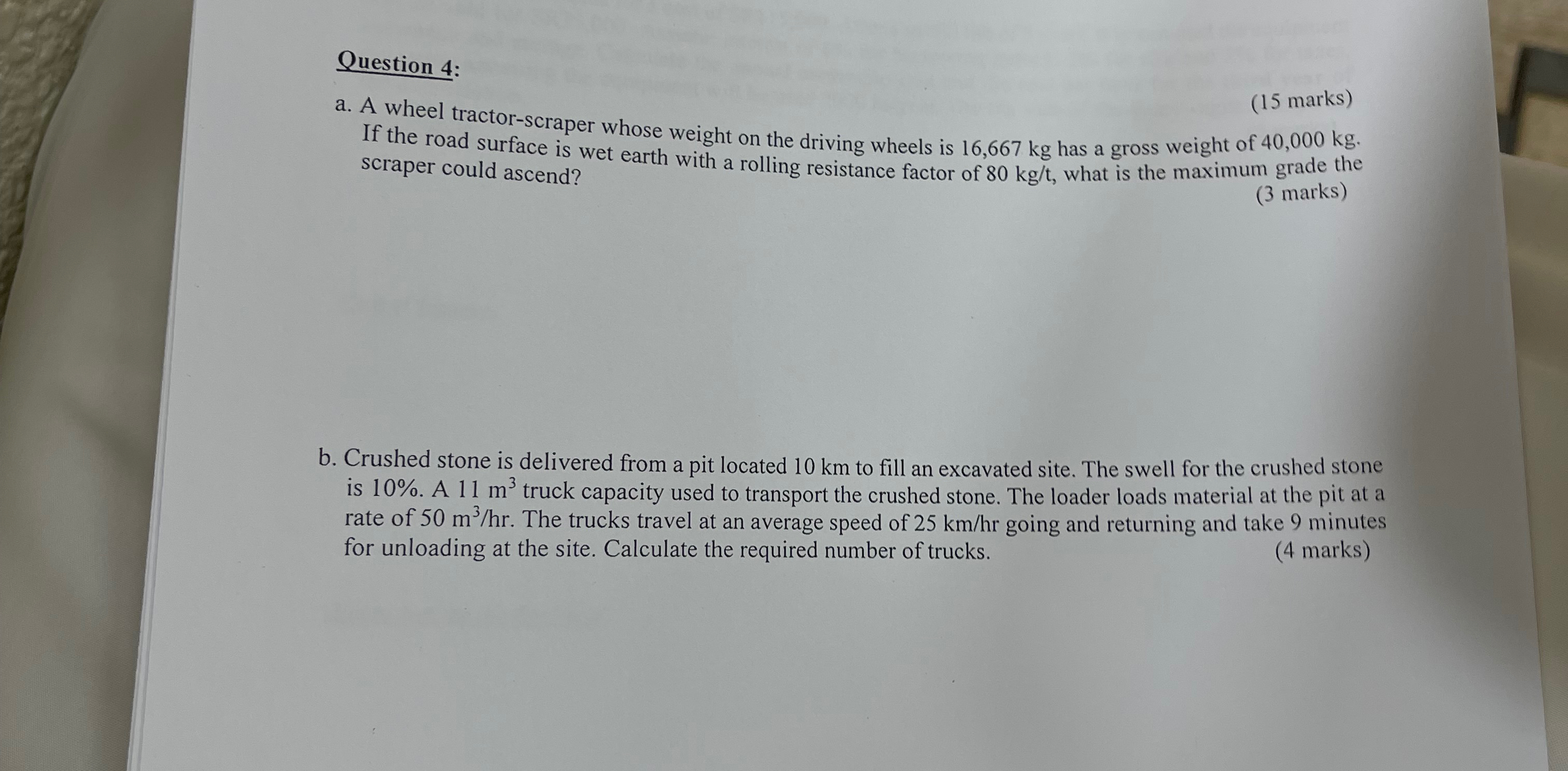 Question 4 : a . A wheel tractor - scraper whose