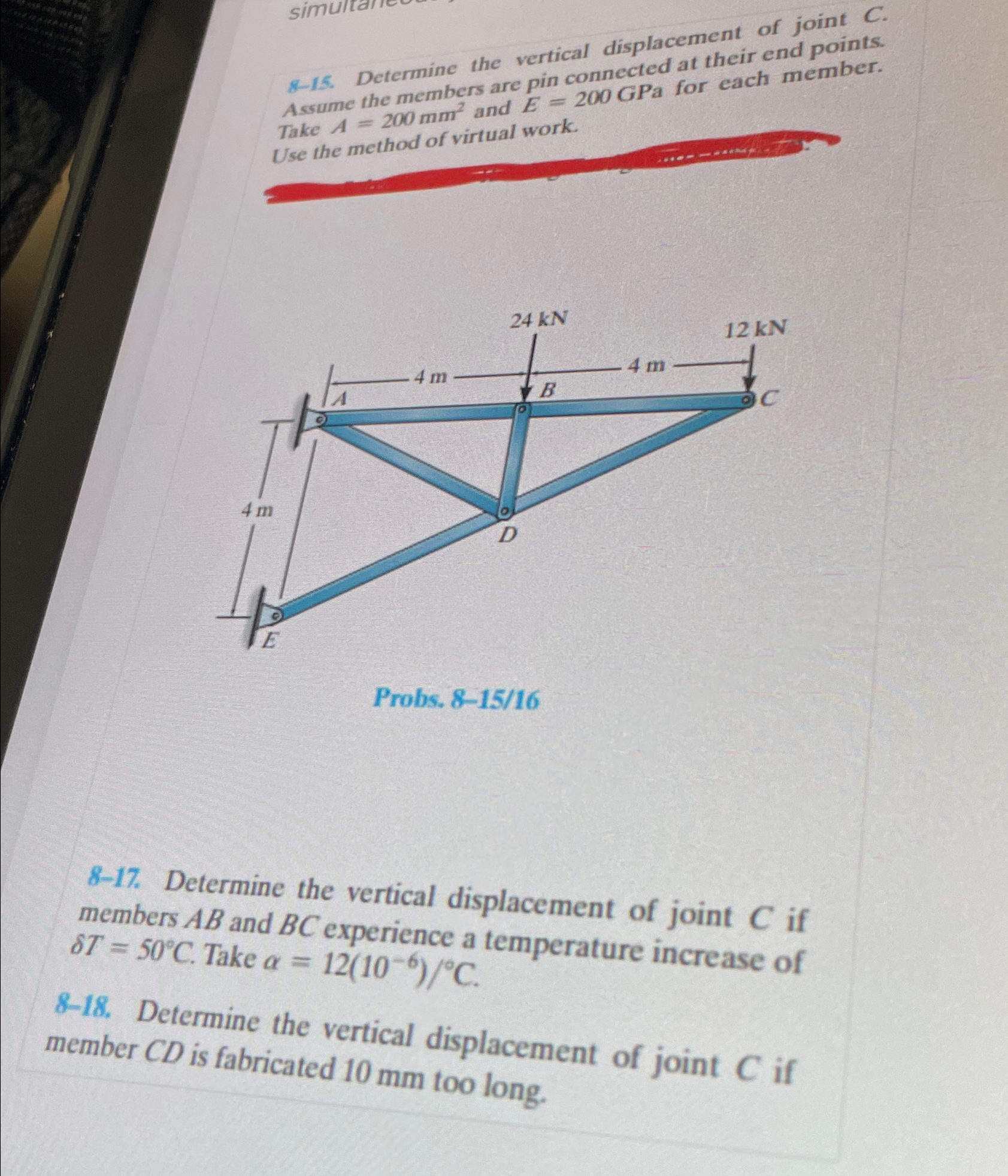 8 - 1 5 . Determine the vertical displacement of