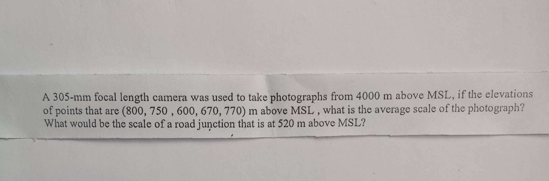 A 3 0 5 - m m focal length camera was used to