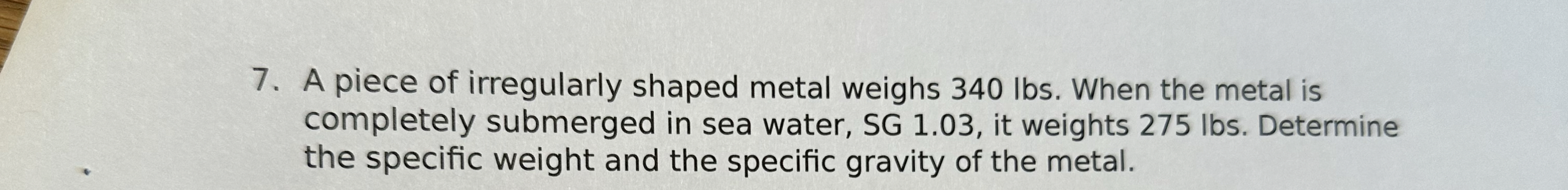 A piece of irregularly shaped metal weighs 3 4 0