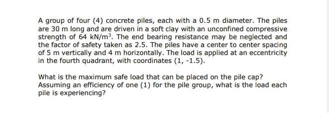 A group of four ( 4 ) concrete piles, each with a