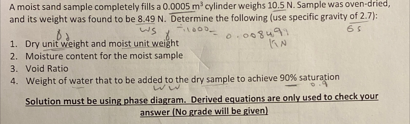 A moist sand sample completely fills a 0 . 0 0 0