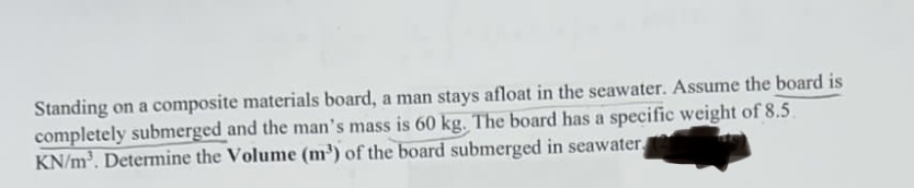 Standing on a composite materials board, a man