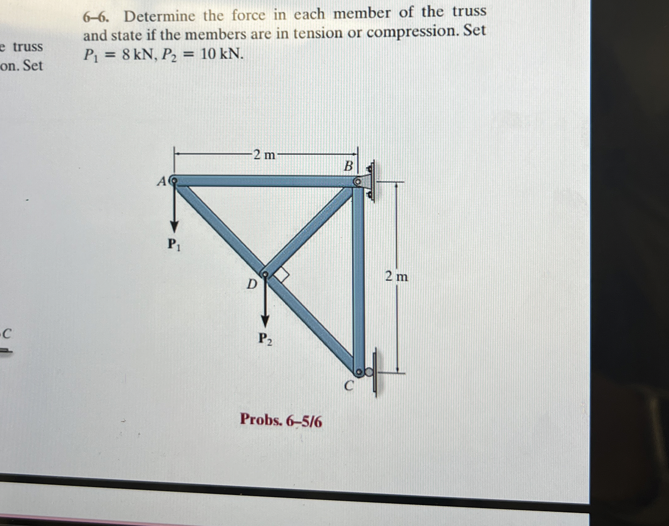 6 - 6 . Determine the force in each member of the