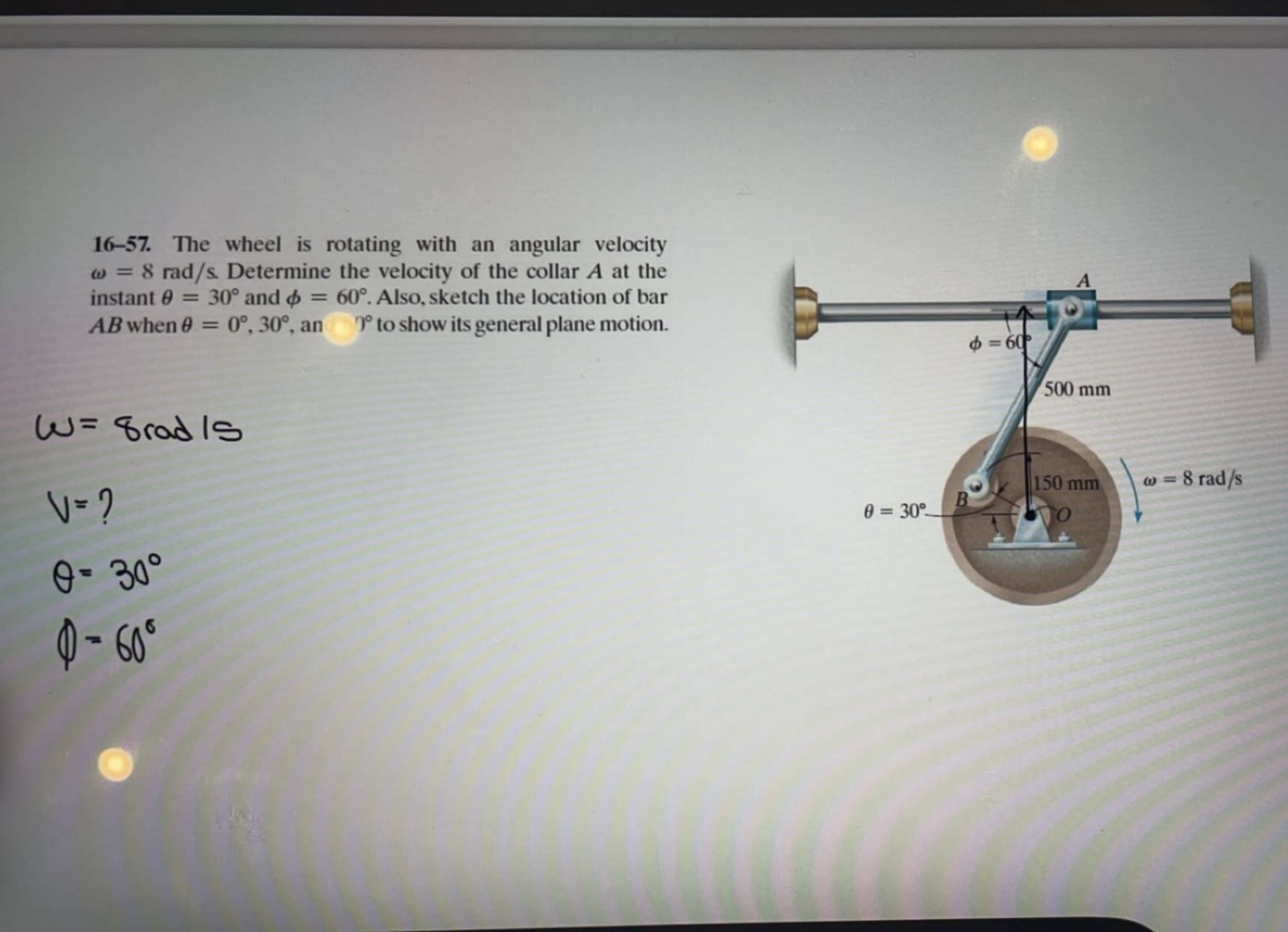 1 6 - 5 7 . The wheel is rotating with an angular