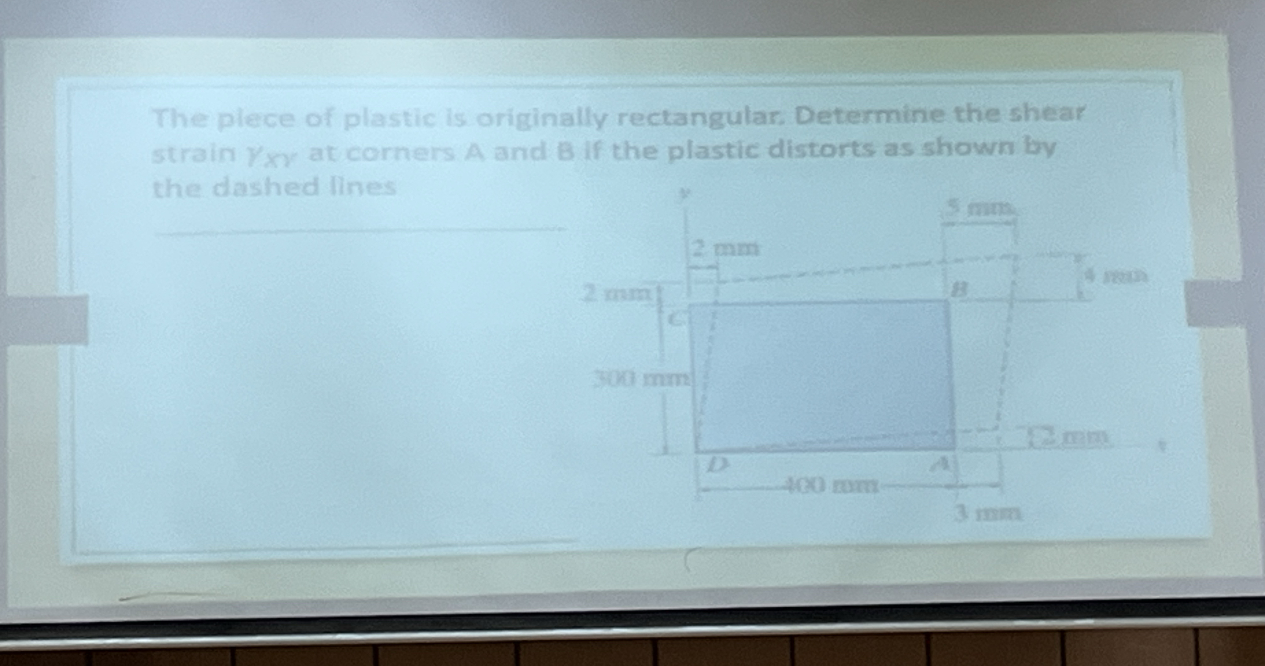 The plece of plastic is originally rectangular.