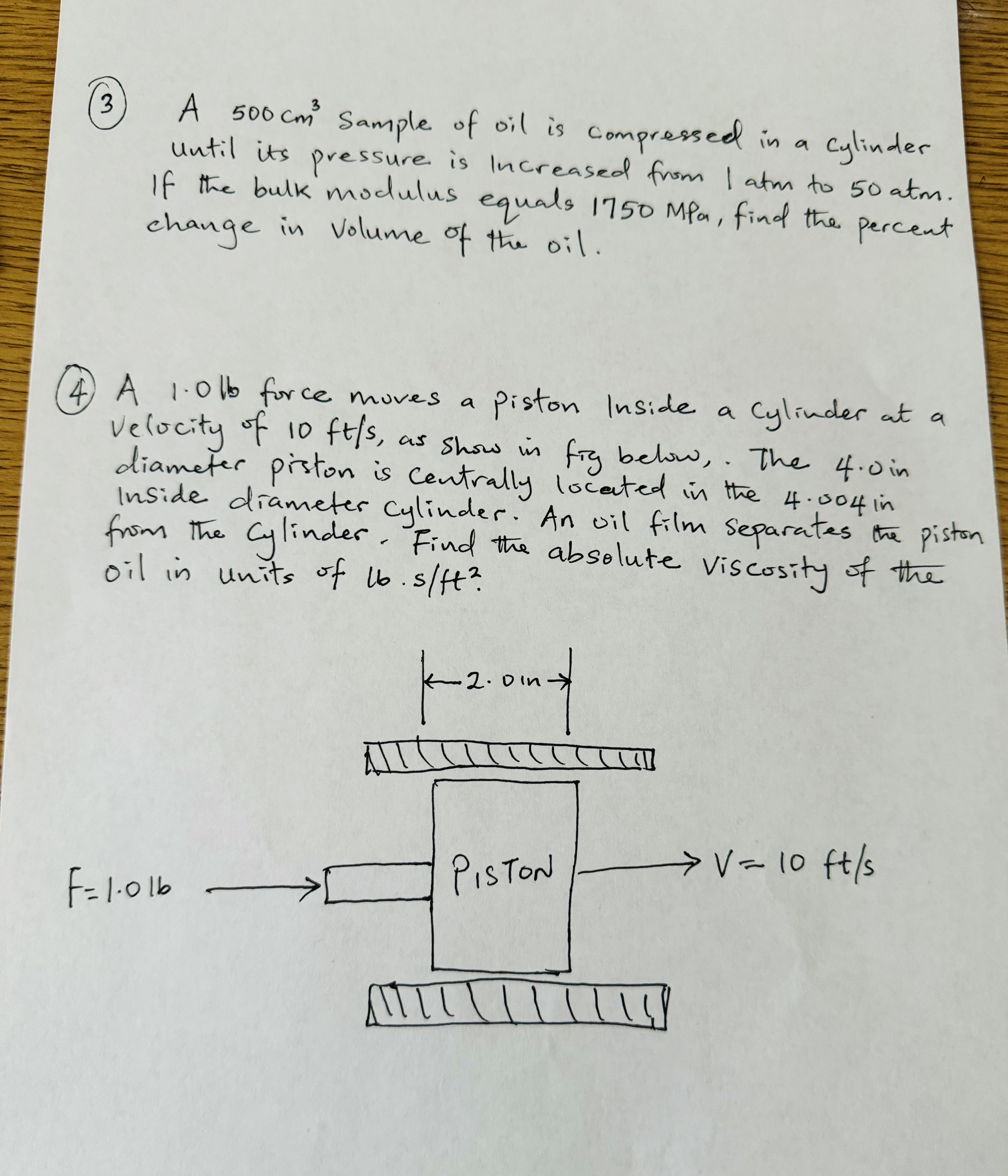 ( 3 ) A 5 0 0 c m 3 sample of oil is compressed