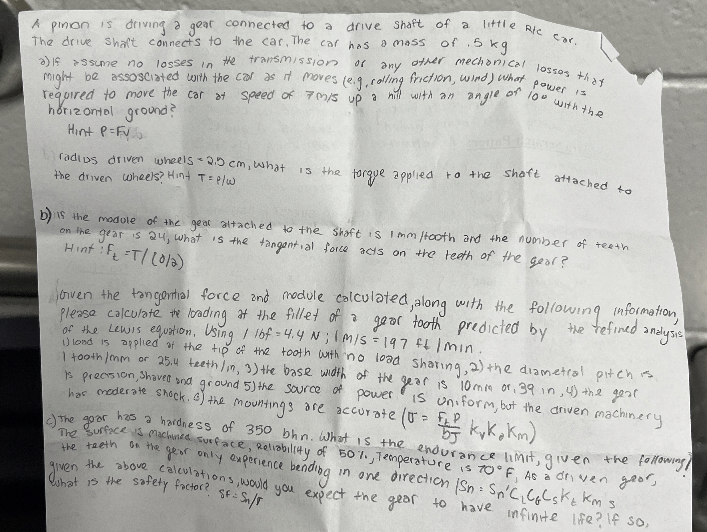 A pinion is driving a gear connected to a drive