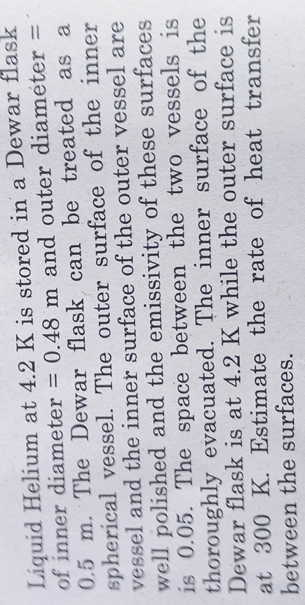 Liquid Helium at 4 . 2 K is stored in a Dewar