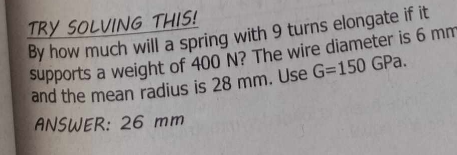 TRY SOLVING THIS! By how much will a spring with