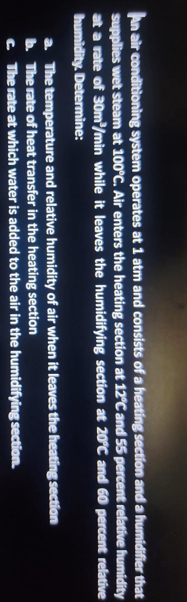 An air condtitioning system operates at 1 atm and