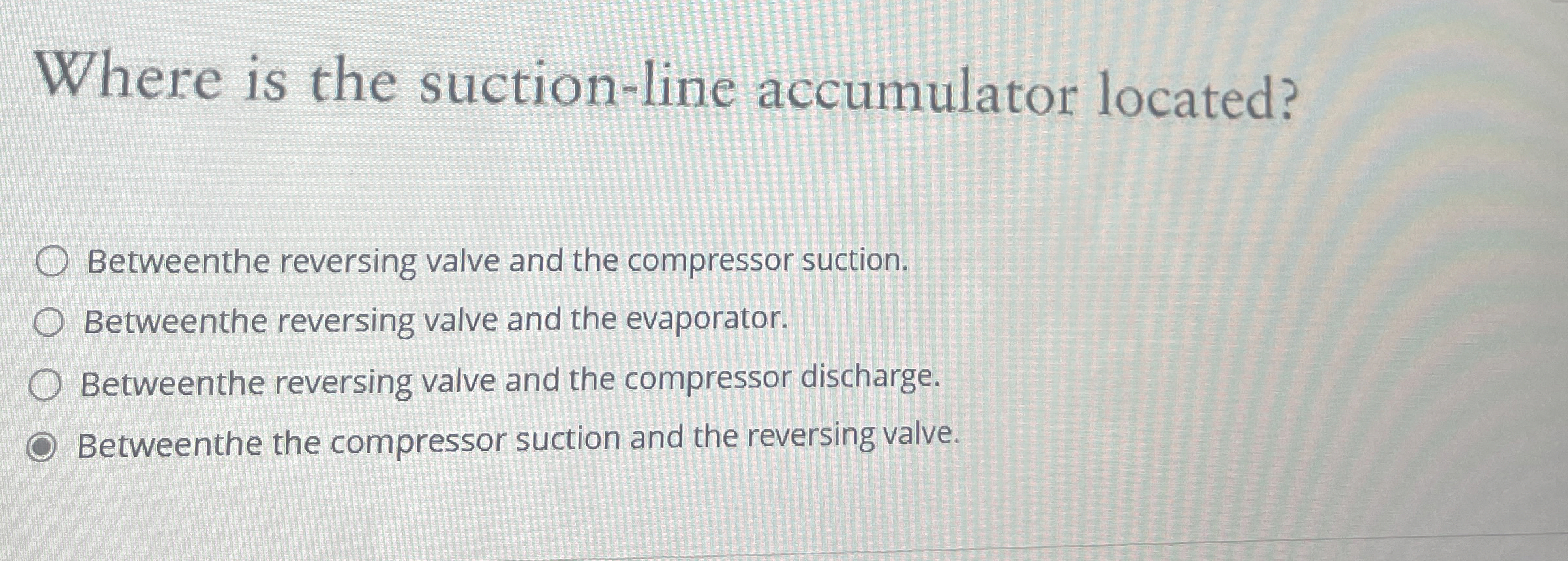 Where is the suction - line accumulator located?