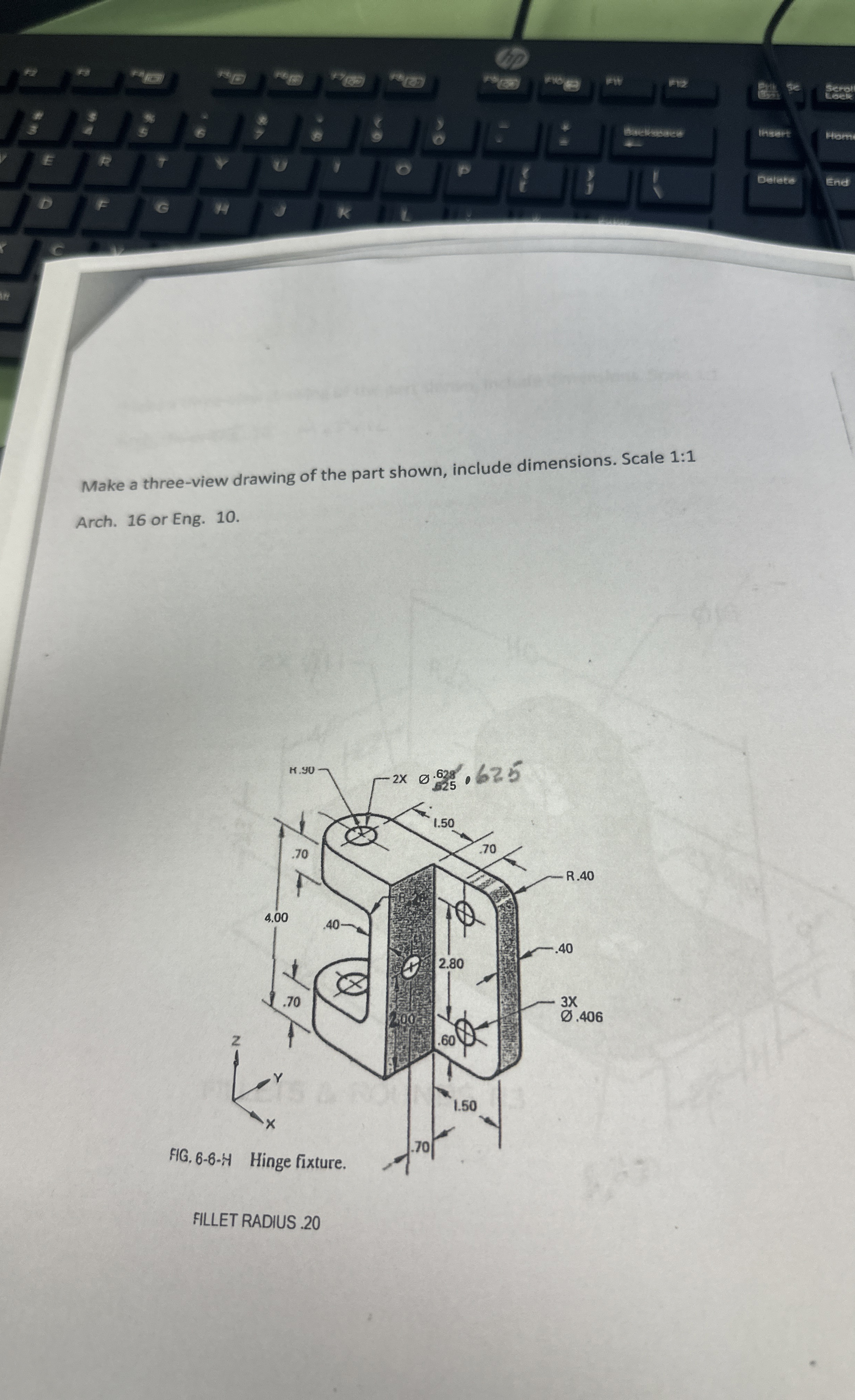 Make a three - view drawing of the part shown,