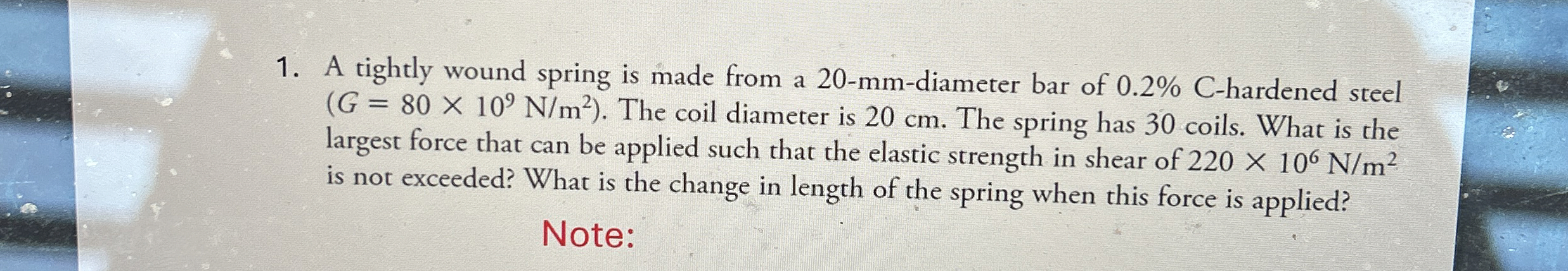 A tightly wound spring is made from a 2 0 - mm -