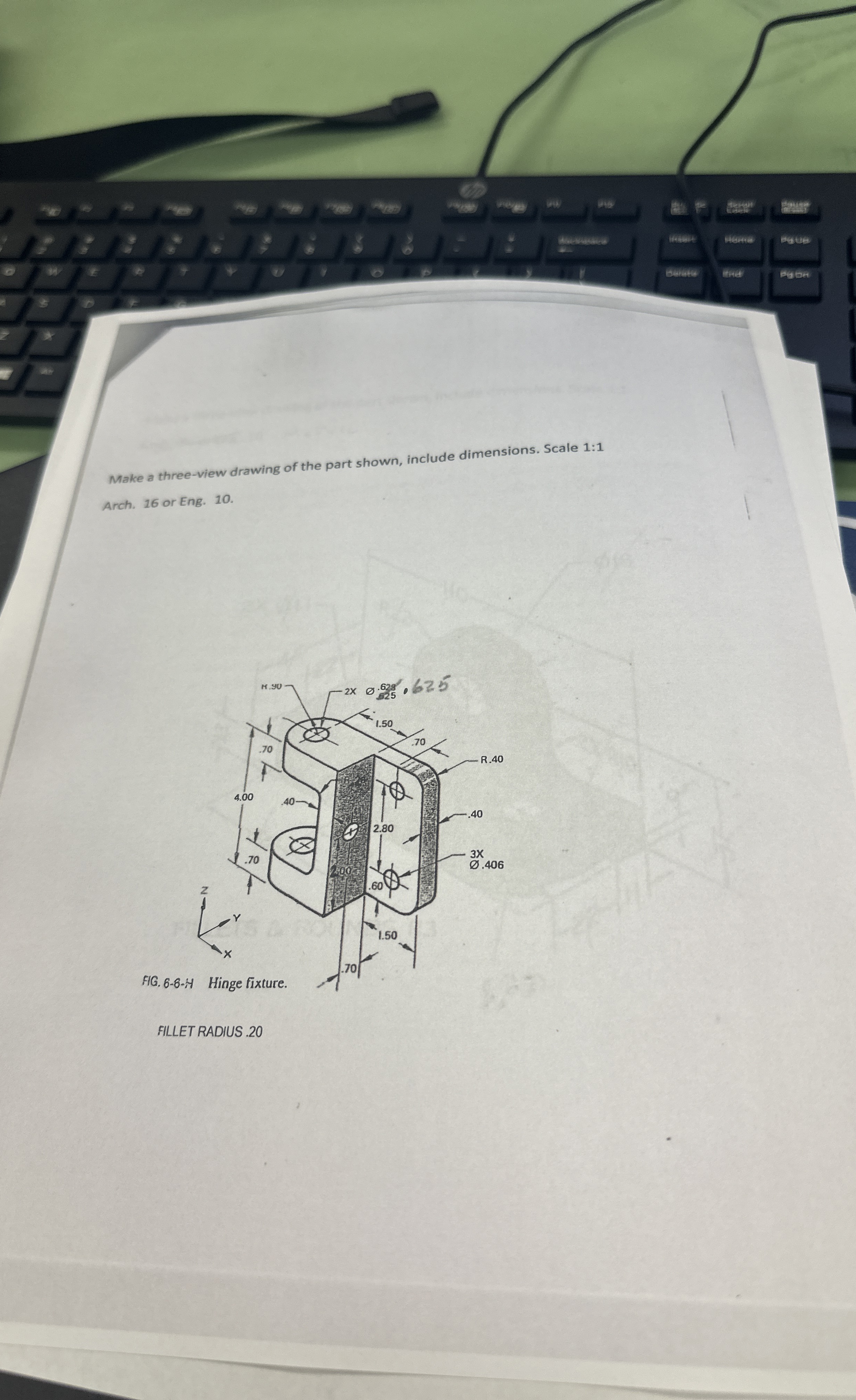 Make a three - view drawing of the part shown,