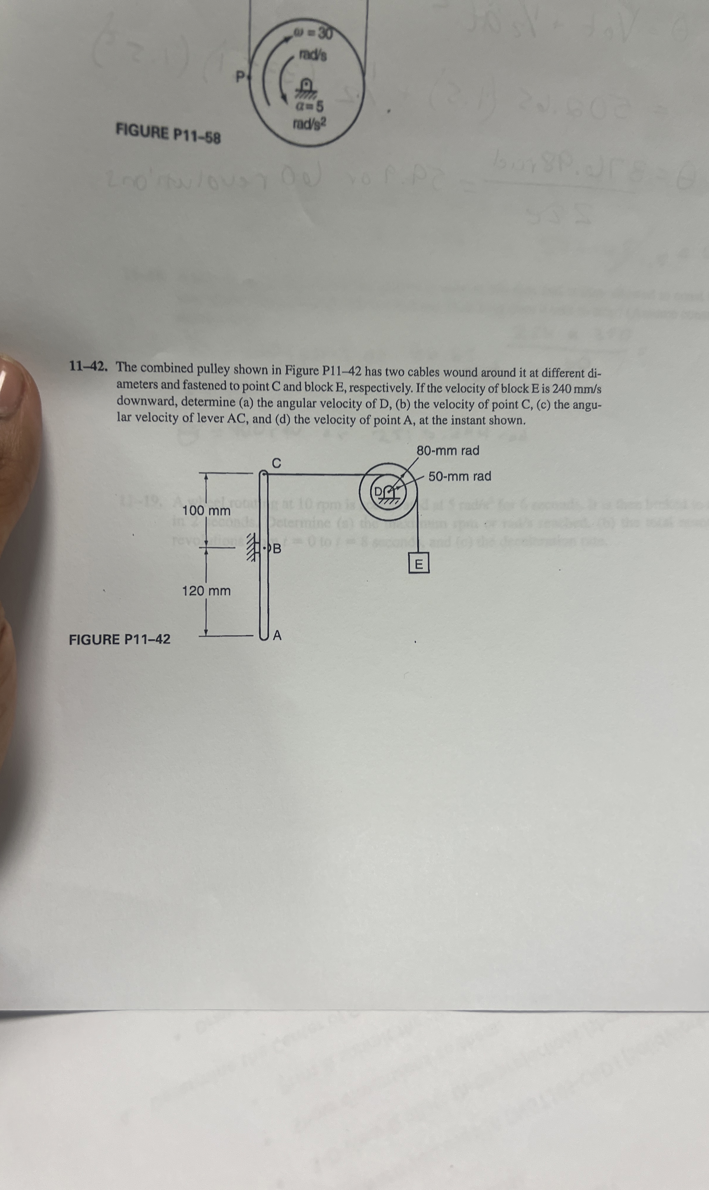 FIGURE P 1 1 - 1 1 1 - 4 2 . The combined pulley