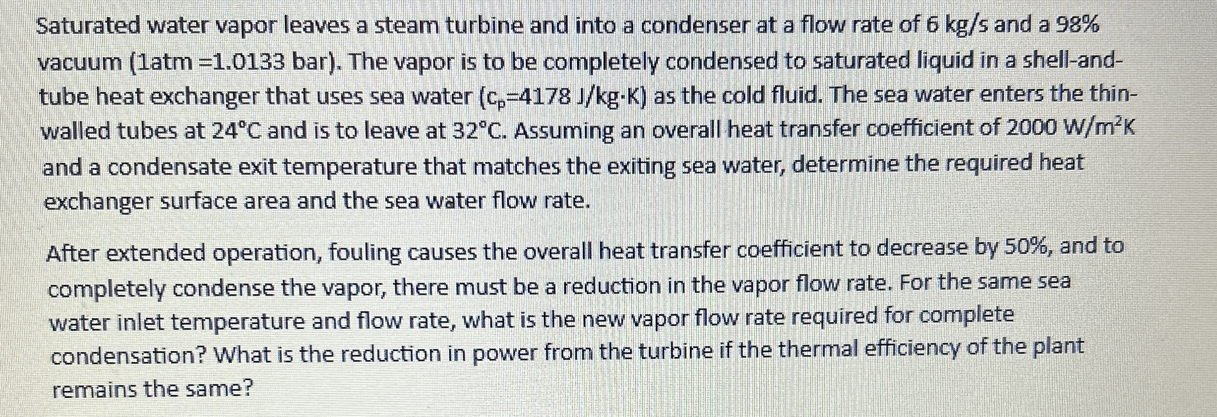 Saturated water vapor leaves a steam turbine and