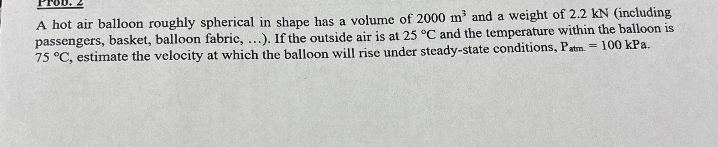 A hot air balloon roughly spherical in shape has