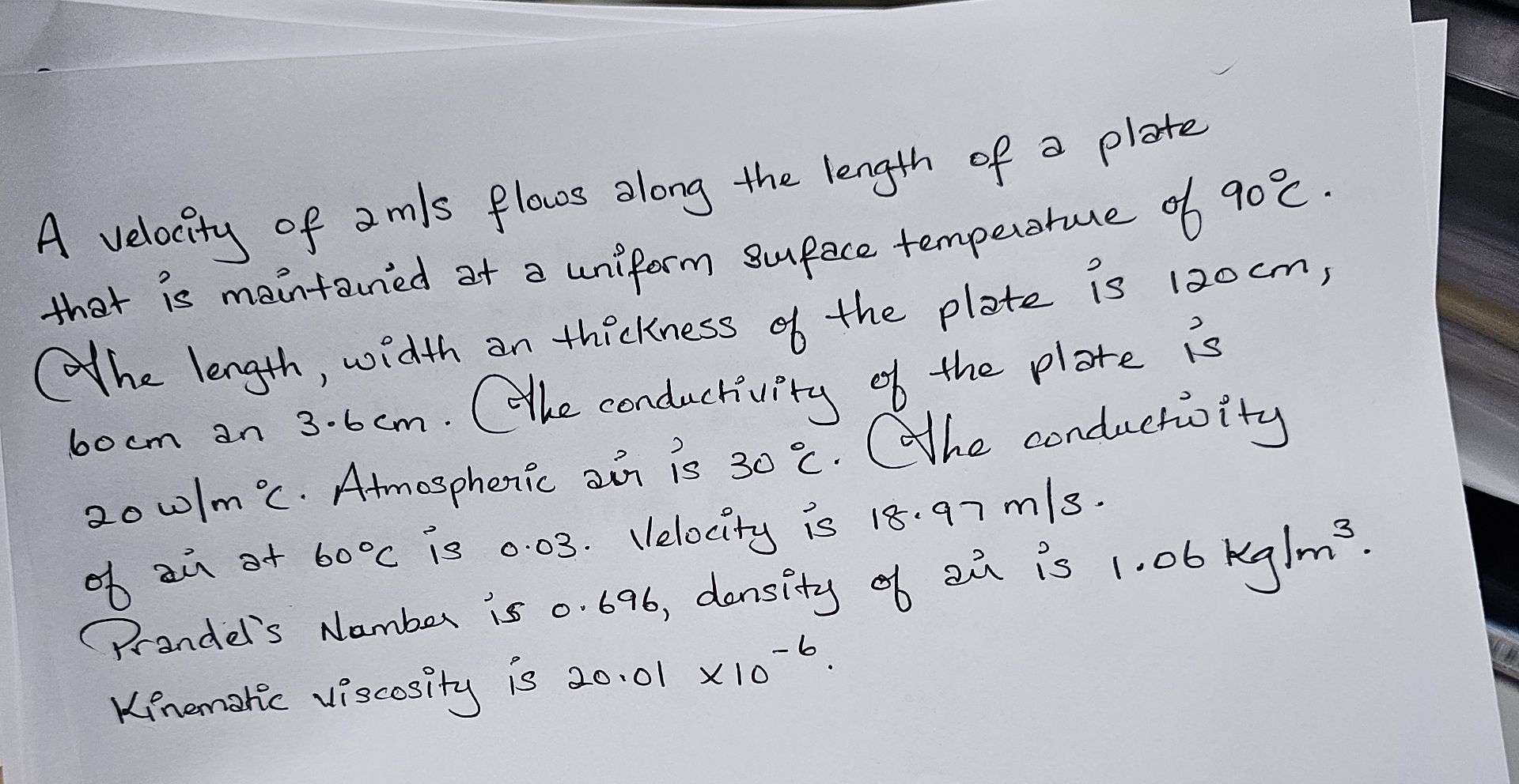 A velocity of 2 m s flows along the length of a