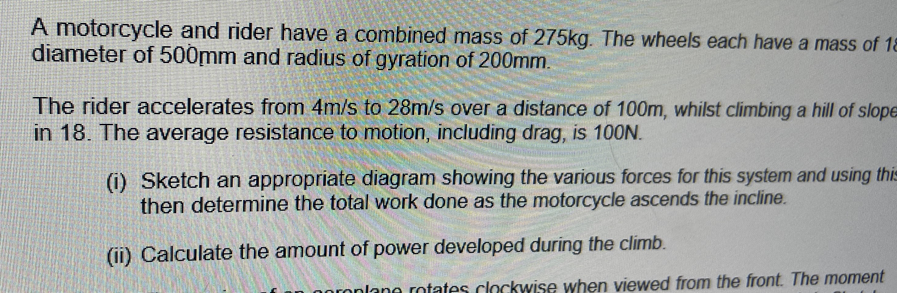 A motorcycle and rider have a combined mass of 2